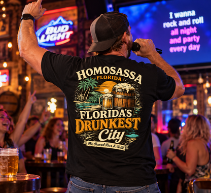 Man in a black Florida's Drunkest City tee singing karaoke at a bar